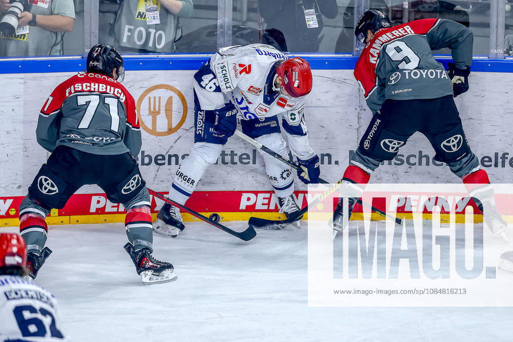 Ice Hockey, DEL, Kölner Haie vs. Schwenninger Wild Wings, Matchday 49, 2026–27 Season, Lanxess Arena, Cologne; Eric Martinsson (SWW, 46) in a battle against Daniel Fischbuch (Cologne Sharks, 71) and Maximilian Kammerer (Cologne Sharks, 09); North Rhine-Westphalia, Germany