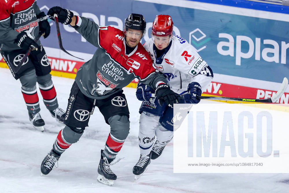 Ice hockey, DEL, Kölner Haie vs. Schwenninger Wild Wings, Matchday 49, 2026–27 season, Lanxess Arena, Cologne; Moritz Müller (Kölner Haie, 91) in a one-on-one battle against Boaz Bassen (SWW, 64), North Rhine-Westphalia, Germany