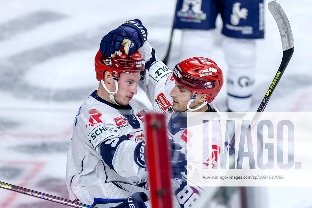 Ice Hockey, DEL, Kölner Haie vs. Schwenninger Wild Wings, Matchday 49, 2026–27 Season, Lanxess Arena, Cologne: Celebrations after the 1–0 goal by Philip Feist (SWW 09) alongside Kyle Platzer (SWW 88), North Rhine-Westphalia, Germany
