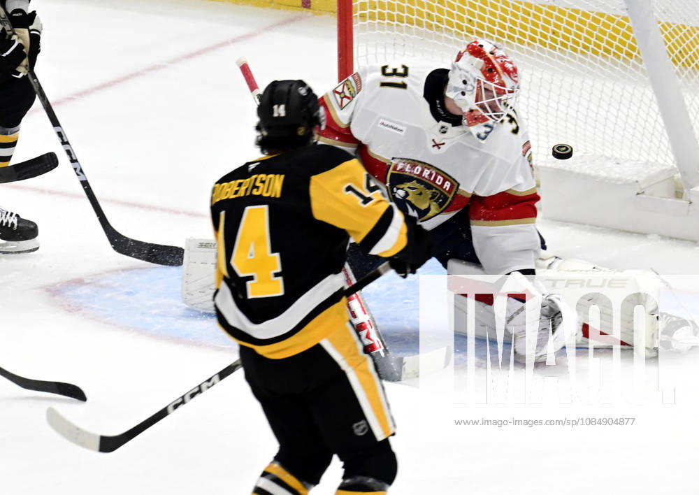 Pittsburgh Penguins left wing Nick Robertson (14) scores on Florida Panthers goalie Cooper Black (31) in the first period at PPG Paints Arena in Pittsburgh on Thursday, October 22, 2026. PIT2026102202 ARCHIExCARPENTER