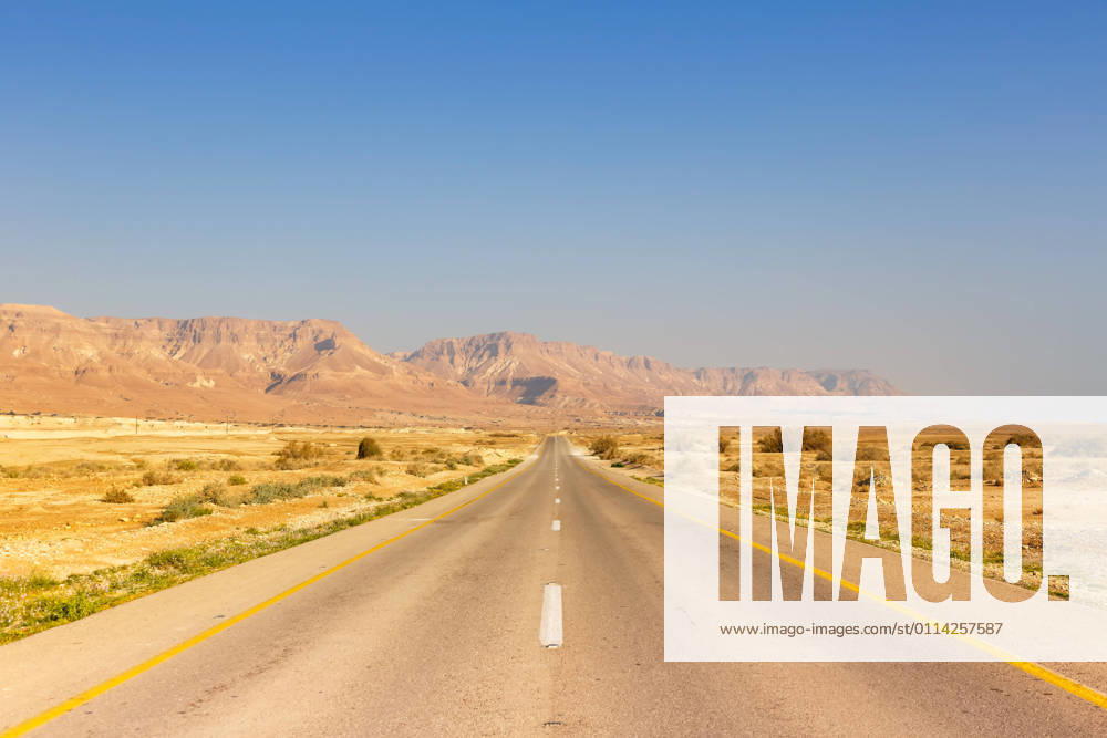 Dead Sea, Israel 23 February 2019 Endless road driving empty desert landscape lonely solitude infinite distance in Israel 1084204089