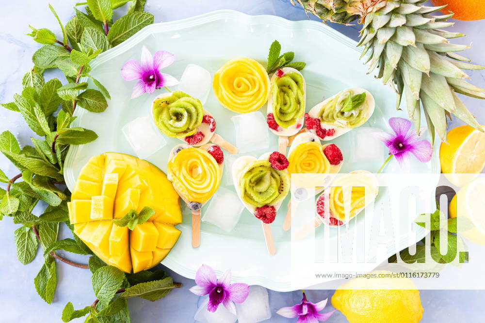 Homemade popsicles with fruit and coconut milk 1079706553
