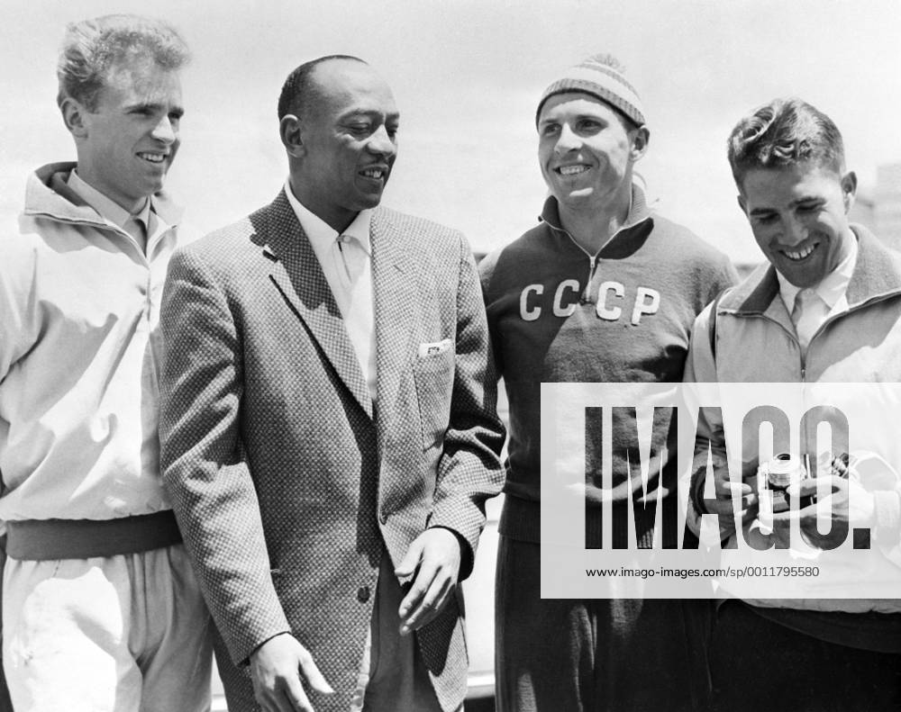 Melbourne. Australia. The 16th Summer Olympic Games. American track and field athlete Jesse Owens (L second) talking with participants of the Olympic Games. TASS_1483812