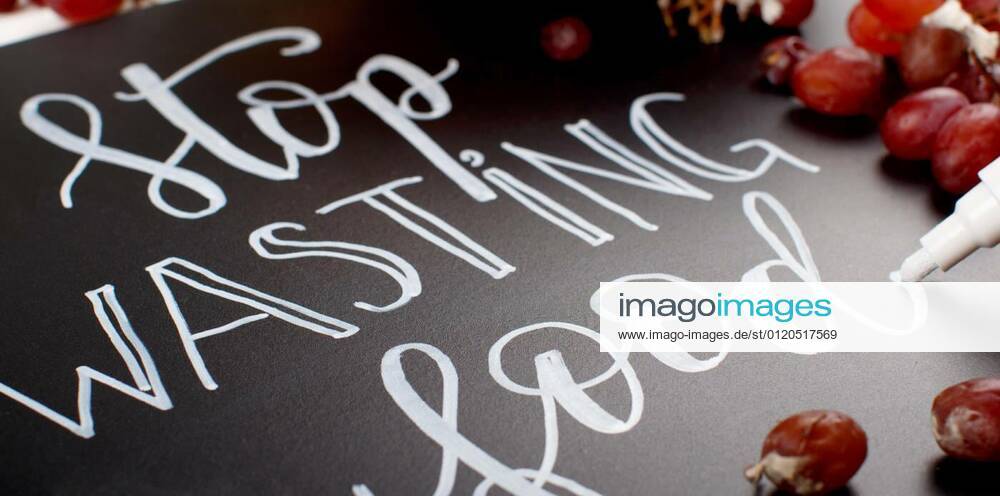 Somebody writing on a chalkboard Stop wasting food lettering, 19.02.2020 11:41:53,