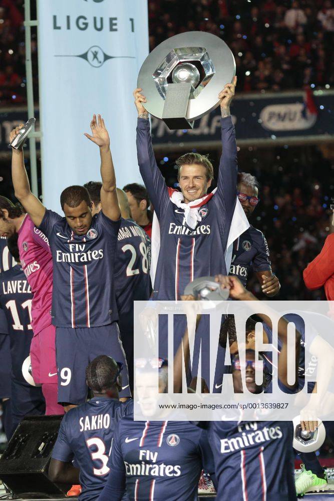 Paris Saint Germain midfielder David Beckham holds up the league trophy during the ceremony for the French league title after the French L1 football match between Paris St Germain (PSG) and Stade Brest on May 18, 2013 at Parc des Princes stadium in Paris.
