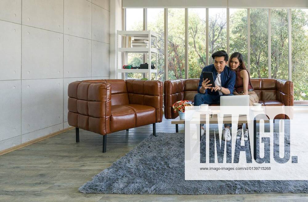 Young lovers spend time together on holidays in the living room. model released, Symbolfotoproperty released, , 14.10.2020,