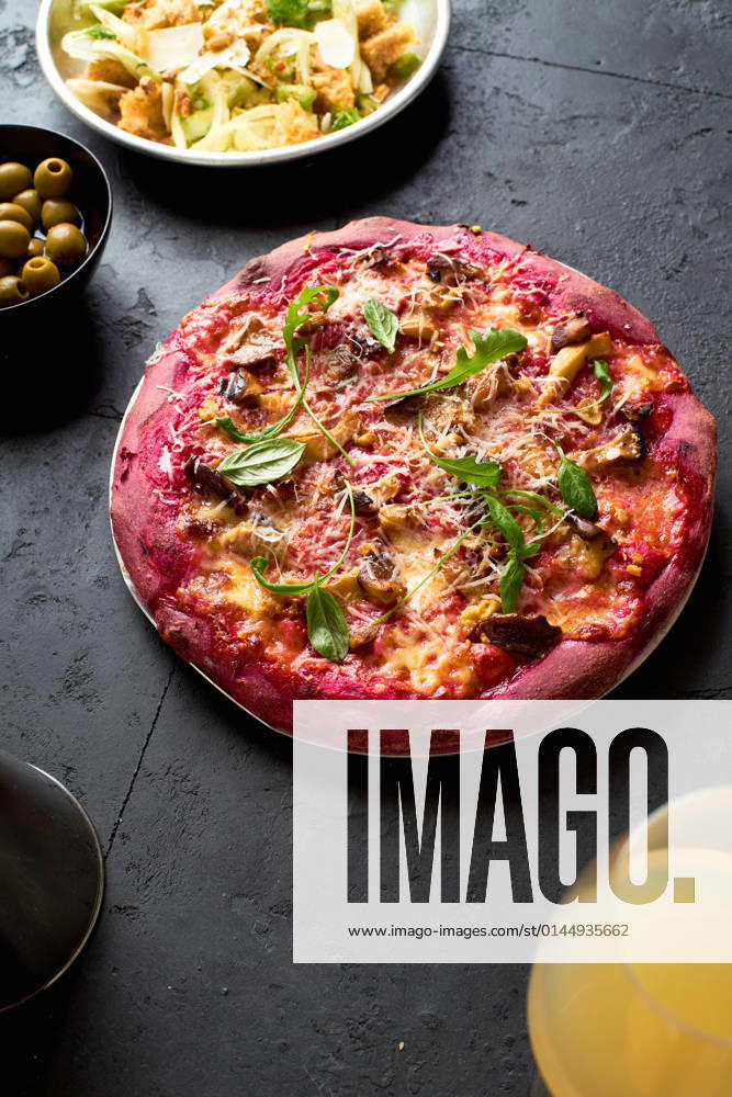 Purple colored rustic pizza with beetroot and vegetarian topping. Top view healthy food recipe AnastasiaNurullina_PurplePizza_10.jpg