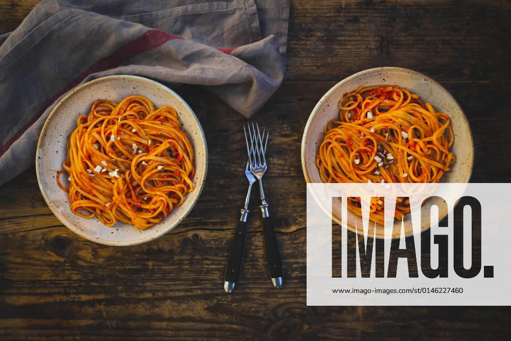 Studio shot of two bowls of vegan linguini with sauce, LVF09178