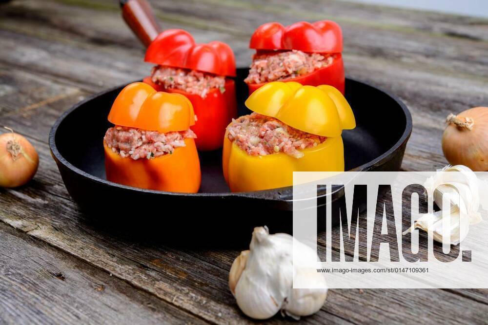 Colorful filled pepper,garlic and onion in iron pan, 25.09.2021,
