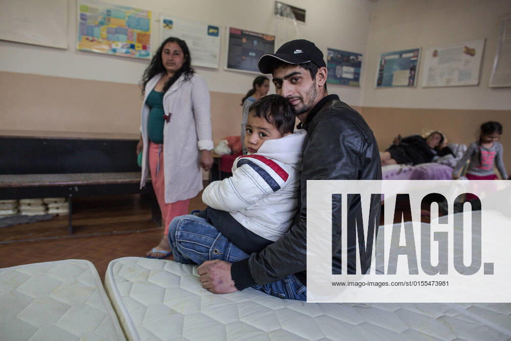 Roma man hugs his son inside the room where they take refuge after fleeing the conflict in Ukraine. The Roma people romanies, also known as gypsies are part of the 4 million people that have been displaced by violence from the armed conflict in Ukraine; placed in refugee aid centers in different parts of Moldova. They are generally organized and separated from other groups..There is no precise data, but according to organizations such as the Fundacion Secretariado Gitano, there are about 400,000 Romas living in Ukraine. Chisinau Moldova - ZUMAs197 20220408_zab_s197_062