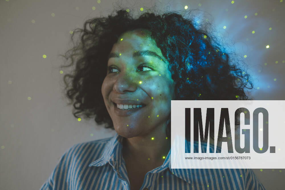 Astro light effect falling on face of woman in front of wall model released, Symbolfoto property released, JOSEF07768