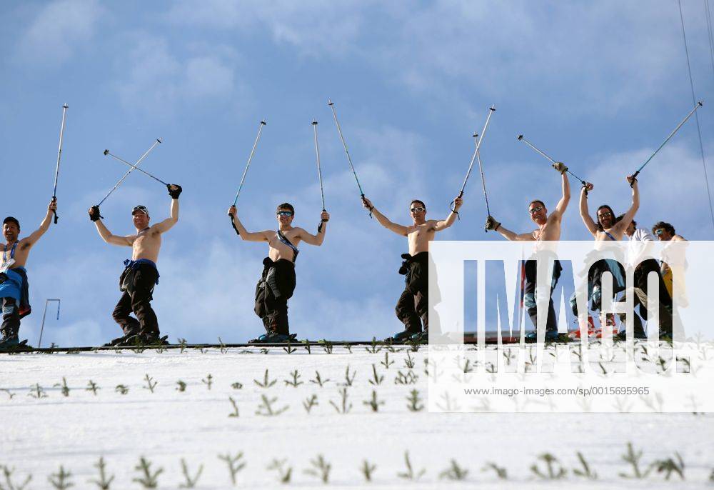 Feb. 10, 2014 - Sochi, Russia - Course workers take off their shirts to enjoy the warm weather as they prepare the landing hill before the Men s Nordic Combined Normal Hill training jump at the RusSki Gorki Jump Center at the 2014 Sochi Winter Olympics. The snow was too warm and one training jump was cancelled due to slushy conditions. Men s Nordic Combined - Sochi 2014 - ZUMAsc5
