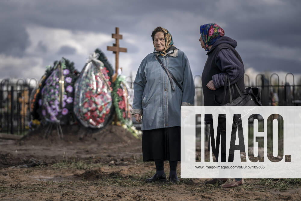 Two women who sing as part of burial ceremonies prepare to sing traditional songs for yet another of many burials at a cemetery in Borodyanka, Ukraine on Tuesday, April 26, 2022. U.S. Secretary of State Antony Blinken told Congress on Tuesday that the Biden administration hasn t seen any evidence that Russian President Vladimir Putin plans to end the war in Ukraine through diplomatic efforts. KYV22020426526 KenxCedeno