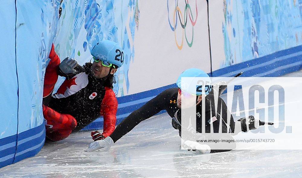 Feb. 15, 2014 - Sochi, RUS - USA s Eduardo Alvariz (256) and Canada s Charles Jamelin (205) collide and fall during the Men s 1000 meter quarterfinal race at the Iceberg Skating Palace during the Winter Olympics in Sochi, Russia, Saturday, February 15, 2014. Men s 1000 meter Short Track Speed Skating - ZUMAm67