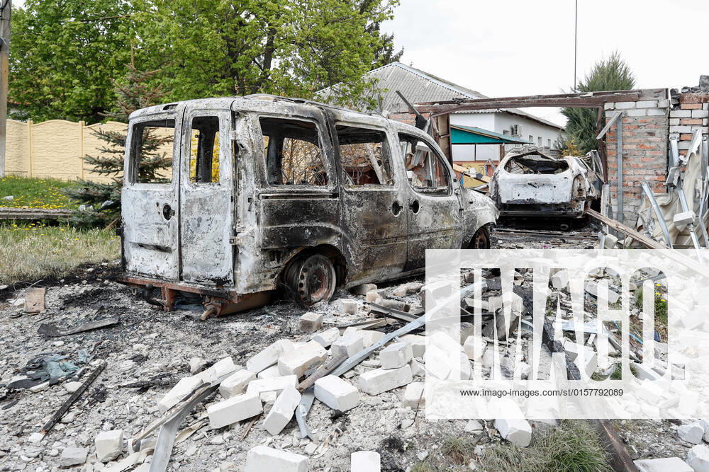 Two damaged vehicles by the Russian air-strike at a village in Kharkiv Oblast of Ukraine, jest a few kilometres from the Russian border, as Russian invasion of Ukraine continues. Kharkiv Oblast Ukraine - ZUMAs313 20220502_zip_s313_004