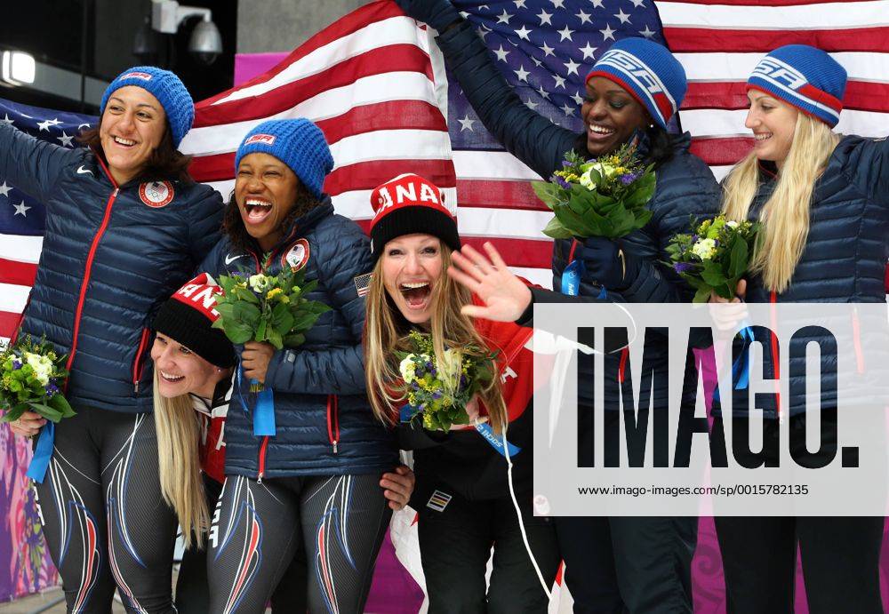 Canada s gold medalists, pilot Kaillie Humphries (2L) and brakewoman Heather Moyse (C) celebrate with U.S. silver medalists, pilot Elana Meyers (L) and brakewoman Lauryn Williams (3L) and compatriots bronze medalists, pilot Jamie Greubel (R) and brakewoman Aja Evans, during the flower ceremony of the women s bobsleigh during the Sochi Winter Olympics on February 19, 2014. OLY20140219503