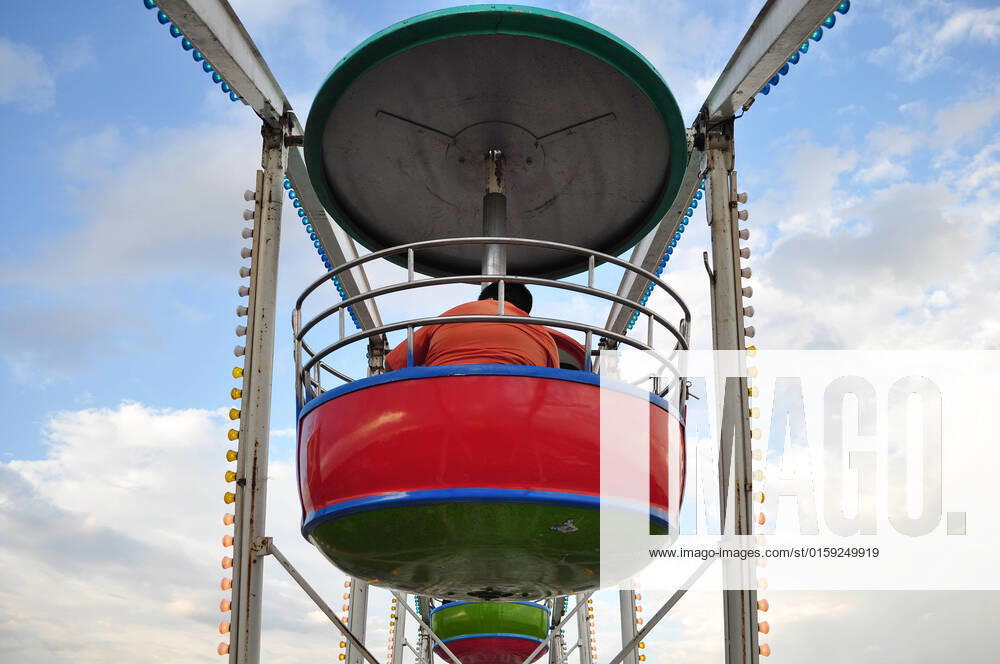 The swing cable basket ferris wheel on blue sky cloud background at amusement park is the family vacation activity on holiday , 23411644.jpg, activity, amusement, amusement park, background, basket, big, blue, cable, carnival, carousel, circle, cloud, color, colorful, entertainment, excitement, fair, fairground, family, ferris, festival, fun, high, holiday, joy, leisure, motion, night, old, outdoor, park, people, photo, ride, roller, round, sky, spin, summer, swing, travel, vacation, view, vintage, wheel, white,