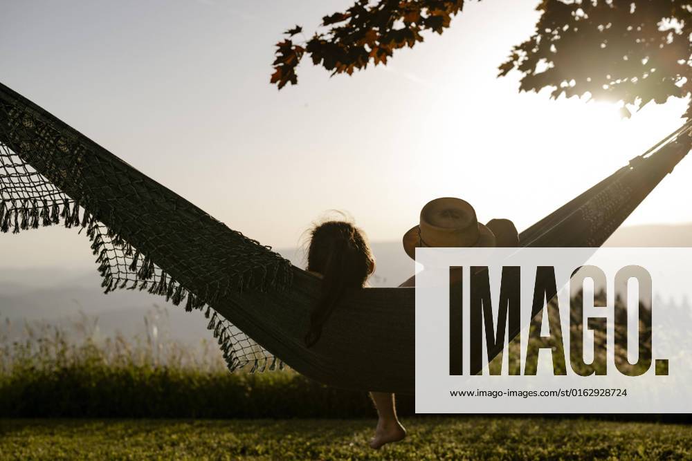 Pair is in a Hammock at Sunset, Carinthia, Austria, Europe