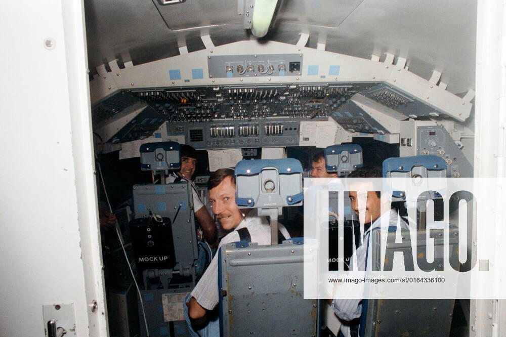 S85-31933 (17 May 1985) --- Four members of the STS 51-G crew participate in a training exercise in the shuttle mission simulation and training facility at the Johnson Space Center. Steven R. Nagel, left foreground, is a mission specialist for the flight, while Sultan Salman Abdelazize Al-Saud (right foreground) is a payload specialist. In the background are astronauts Daniel C. Brandenstein (left) in the commander s station and John O. Creighton in the pilot s position.
