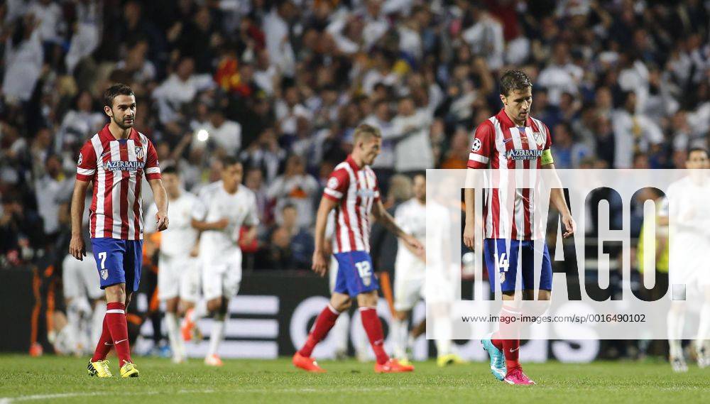 Adrian Lopez (Atletico Madrid 7) and Gabi (Atletico Madrid 14) upset after the goal of Sergio Ramos (Real Madrid CF 4) during the final of the Champions league between Real Madrid and Atletico Madrid, Estadio da Luz in Lisbon on May 24., 2014. Real Madrid gegen Atletico Madrid im Finale der Champions League, Saison 2013 2014 am 24. Mai 2014.