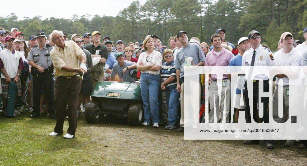 U.S. - KRT SPORTS STORY SLUGGED: MASTERS KRT PHOTO BY JASON CLARK THE STAMP (April 12) AUGUSTA, GA -- Arnold Palmer hits a recovery shot from out of the crowd after his approach went far to the right on the ninth hole on Friday, April 12, 2002 during the second round of The Masters at Augusta National Golf Club. (CS) NC KD BL 2002 (Horiz) (mvw) News Archive - April 12, 2002 - ZUMAm67