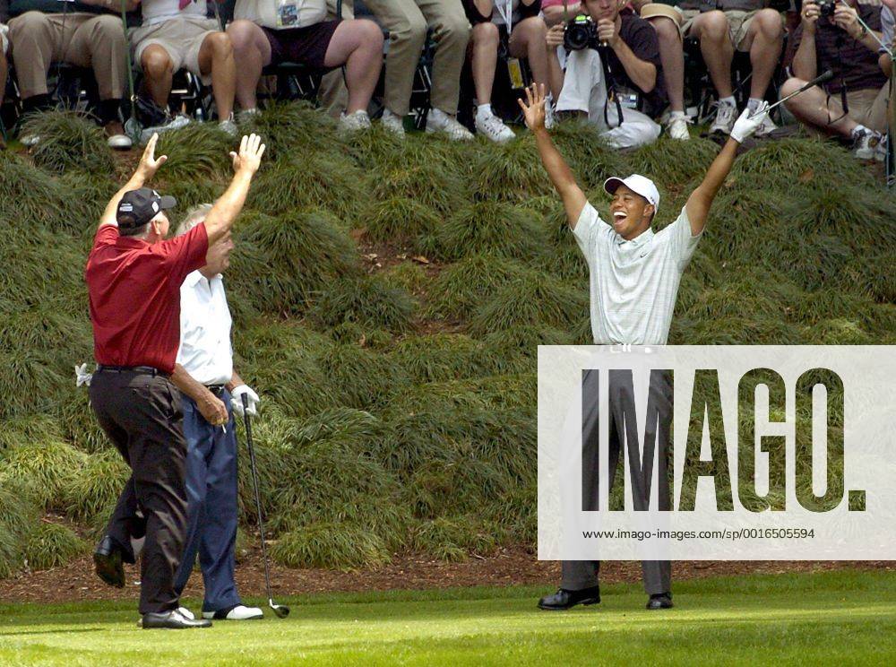 U.S. - Tiger Woods celebrates his hole-in-one with Mark O Meara (red shirt) and Arnold Palmer on the 9th hole of the annual Par 3 Contest that was held on the final day of practice for the Masters golf tournament at the Augusta National Golf Club in Augusta, GA., Wednesday, April 7, 2004. (Photo by Erik Campos News Archive - April 7, 2004 - ZUMAm67