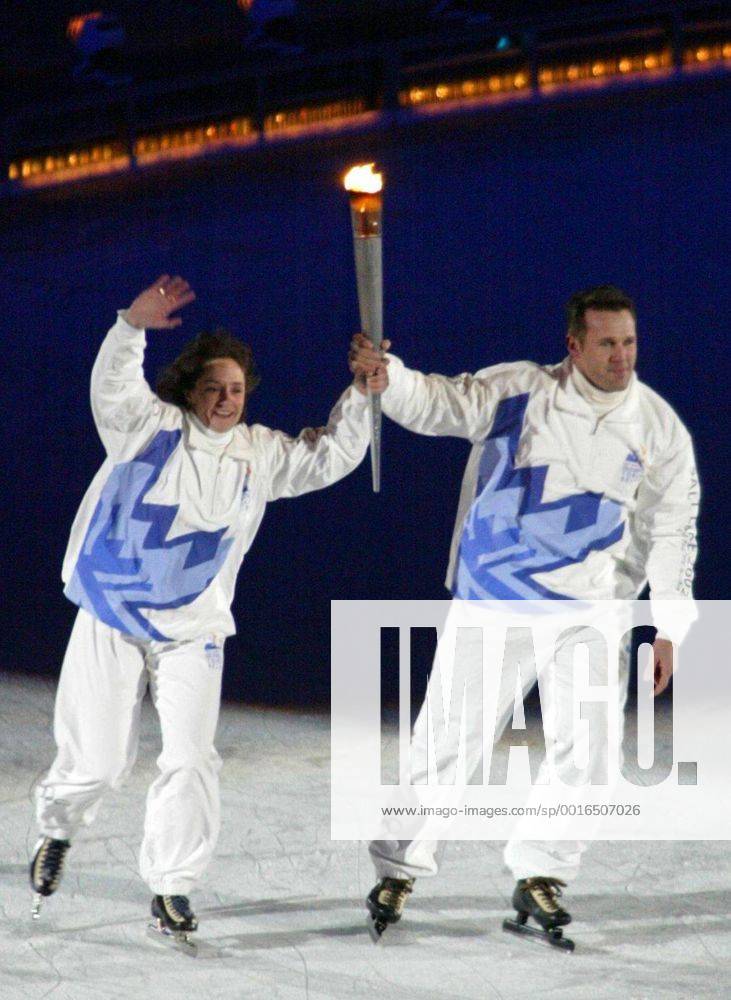 Feb. 8, 2002 - U.S. - SALT LAKE CITY, UT-- Former Olympians Bonnie Blair (left) and Dan Jansen skate with the torch toward the Olympic cauldron at the Winter Olympic Opening Ceremony Friday February 8, 2002 in Salt Lake City, Utah. (DA) - Feb. 8, 2002 - ZUMAm67