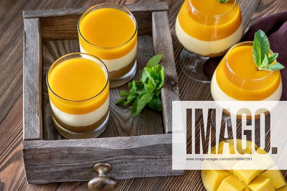 Mango cheesecake, Mango cheesecake served in the glasses on rustic background, 09.06.2021,