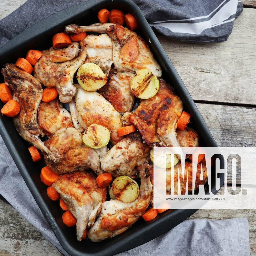 Roasted Hare Haunches in Pan with Stewed Vegetables on Rustic Wooden Table Surface, Roasted Hare Haunches in Pan with Stewed Vegetables on Rustic Wooden Table Surface ., Roasted Hare Haunches in Pan with Stewed Vegetables on Rustic Wooden Table Surface ., 23.04.2022,