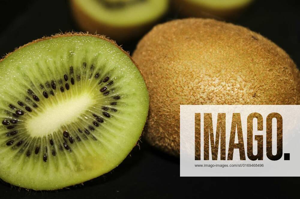 Half a kiwi and a whole kiwi close-up on a black background, Half a kiwi and a whole kiwi close-up on a black background.., Half a kiwi and a whole kiwi close-up on a black background.., 05.06.2022,