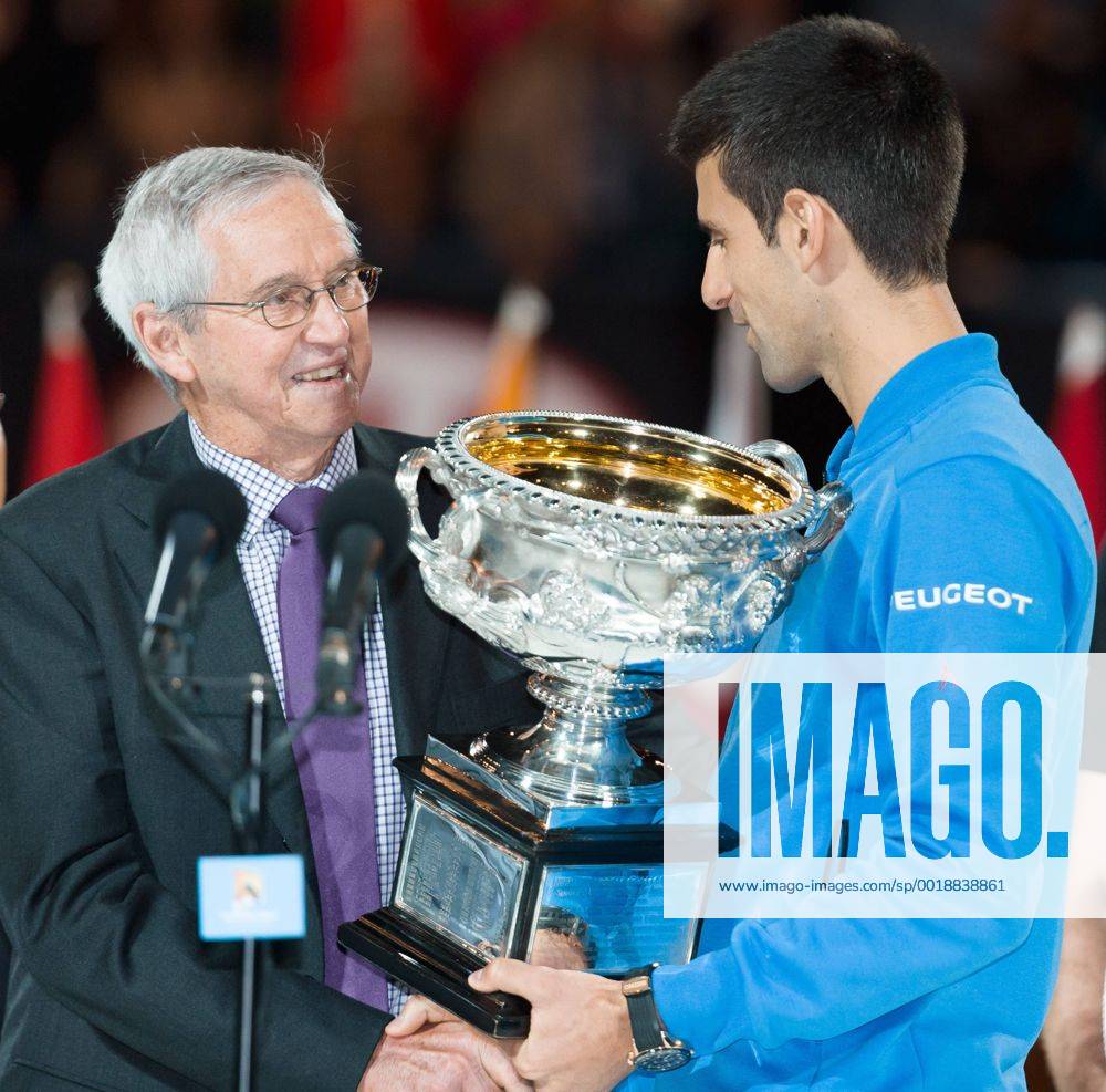 Roy Emerson presents the trophy to 1st seed Novak Djokovic (SRB) for winning the Men s Final match on day fourteen of the 2015 Australian Open grand slam tennis tournament at Melbourne Park in Melbourne, Australia. - ZUMAc04_