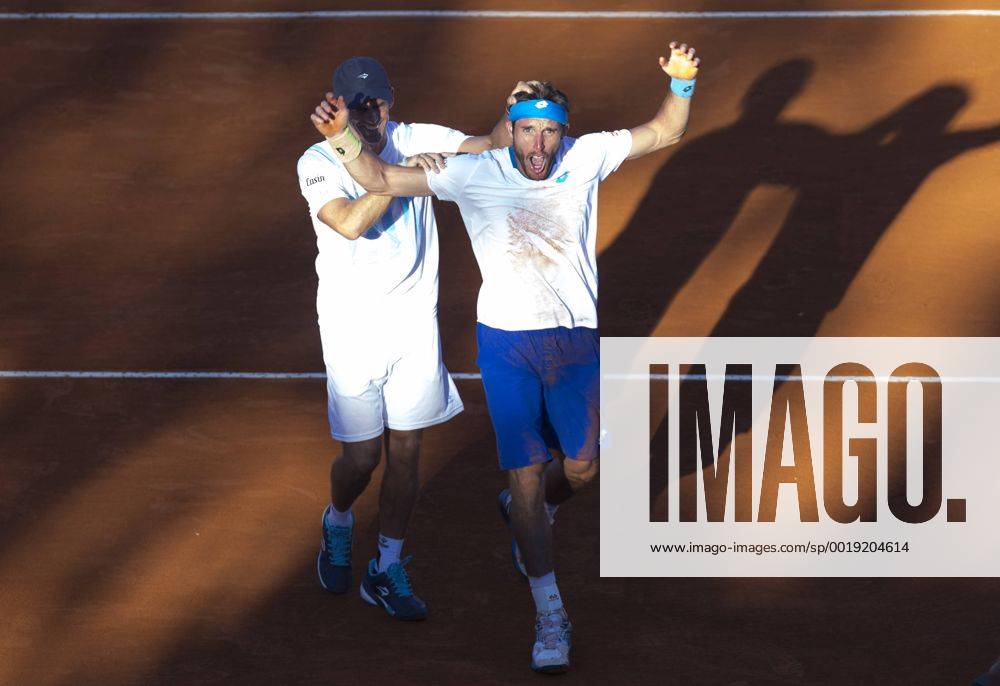 Argentina s Leonardo Mayer (R) celebrates with his captain Daniel Orsanic after the Davis Cup World Group first round singles match in Villa Martelli, near Buenos Aires, capital of Argentina, March 8, 2015. The match broke the record of duration with 6 hours and 42 minutes, as the longest match in the history of the Davis Cup. MartinxZabala) (da) (SP)ARGENTINA-VILLA MARTELLI-TENNIS-DAVIS CUP e MARTINxZABALA