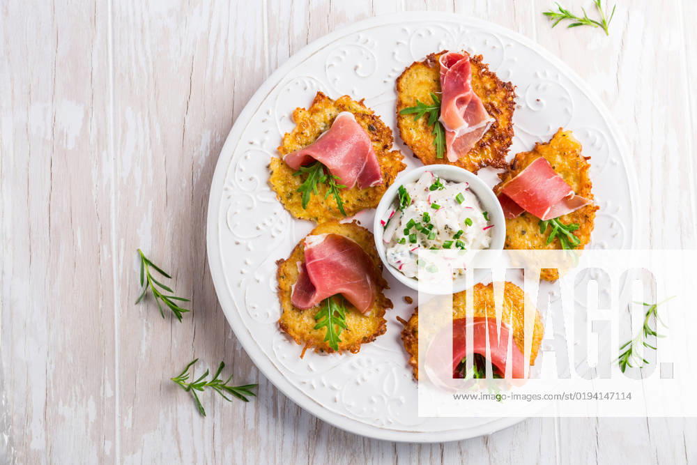 Potato pancake with prosciutto and dip of radishes cream cheese and chives. Healthy food concept. Potato pancake with prosciutto and dip of radishes cream cheese and chives. Healthy food concept.