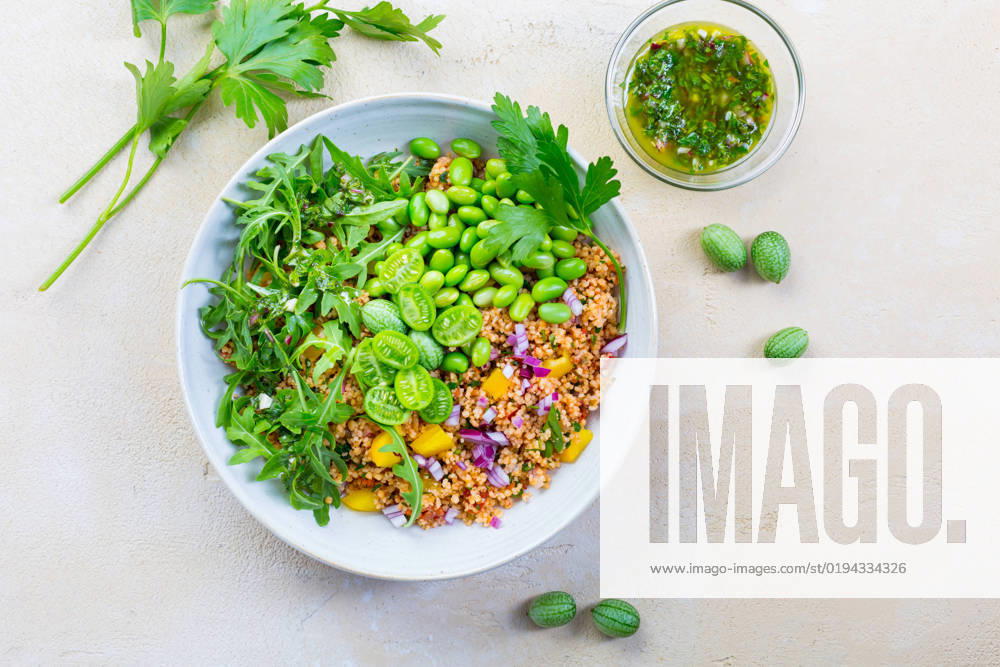 Healthy couscous salad with edamame beans Healthy couscous salad with edamame beans, rucola and cucamelon (Mexican miniature watermelon), with lemon and herbs dressing