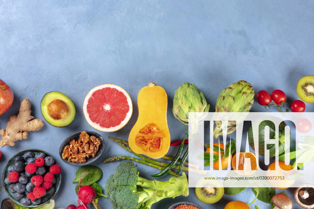 Vegan food. Healthy diet concept. Fruits, vegetables, nuts, mushrooms, shot from the top. A flat lay composition with a place for text Vegan food. Healthy diet concept. Fruits, vegetables, nuts, mushrooms, shot from the top. A flat lay composition with a place for text