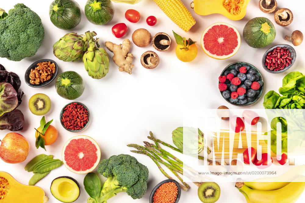 Vegan food. Healthy diet concept. Fruits, vegetables, pasta, nuts, legumes, mushrooms, shot from the top on a white background, forming a frame with a place for text. A flat lay composition Vegan food. Healthy diet concept. Fruits, vegetables, pasta, nuts, legumes, mushrooms, shot from the top on a white background, forming a frame with a place for text. A flat lay composition