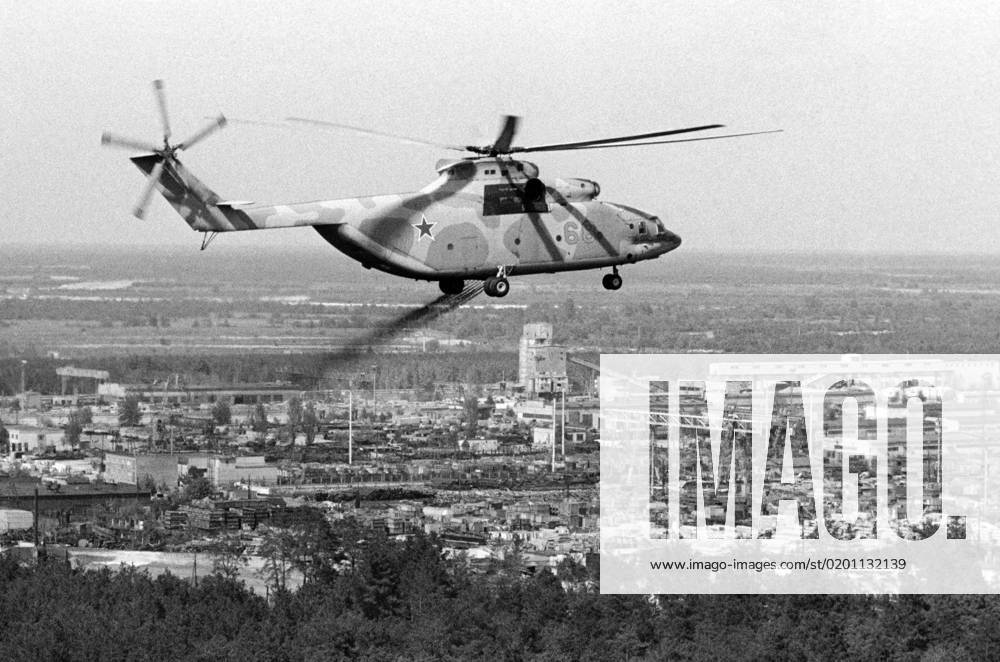 Kiev Region, Ukrainian SSR, USSR. The Mi-26 helicopter decontaminates the area from the air in the thirty-kilometer exclusion zone after the accident at the Chernobyl Nuclear Power Plant. On April 26, 1986, an explosion occurred in the reactor no. 4 of the nuclear power plant during equipment tests after the shutdown of the reactor for the next scheduled preventive maintenance. Valery Zufarov TASS 1470256