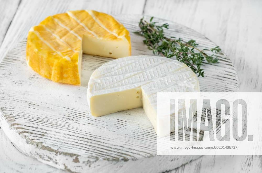Camembert cheese, Two camembert cheese wheels on the cutting board, Two camembert cheese wheels on the cutting board, 08.01.2023,
