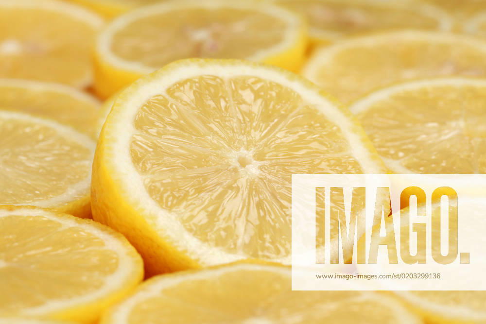 Group of sliced lemons forming a background