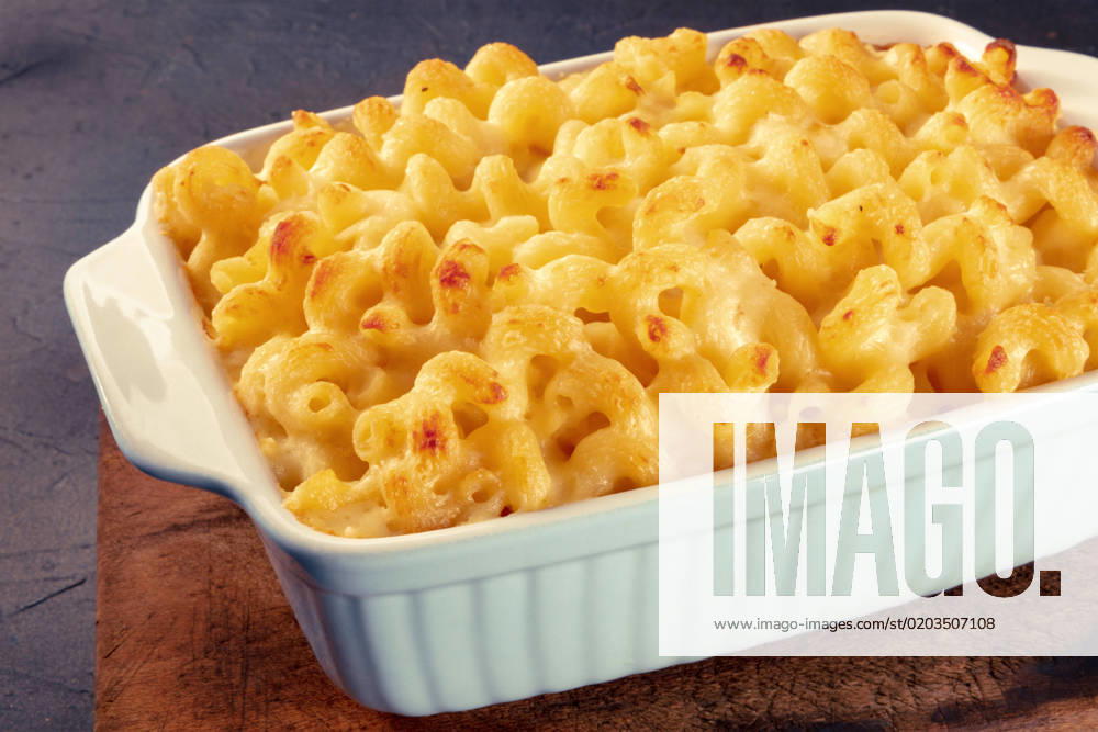 Macaroni and cheese pasta in a casserole, cheesy American dish, baked Macaroni and cheese pasta in a casserole, cheesy American dish, baked in the oven