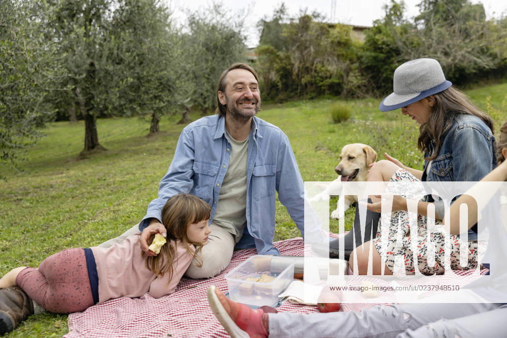 Happy family together having picnic on field model released, Symbolfoto property released, EIF04210