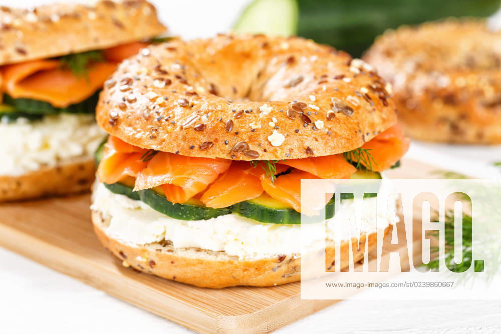 Bagel roll sandwich for breakfast topped with salmon fish on a board in Stuttgart, Germany Stuttgart, Germany 15 March 2023 Bagel roll sandwich for breakfast topped with salmon fish on a board in Stuttgart, Germany