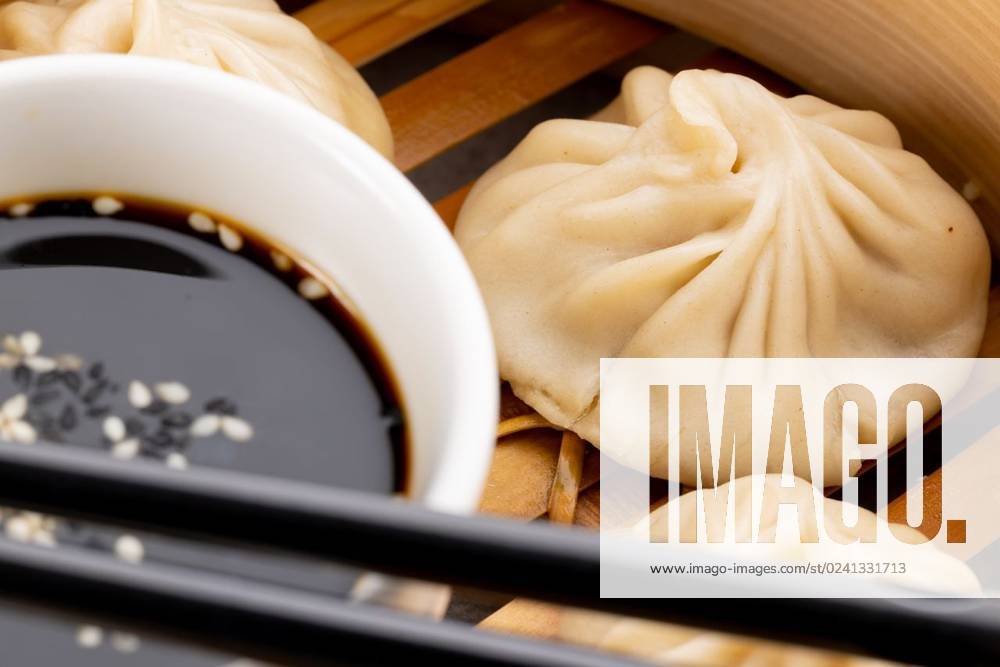 IMAGO Creative, Food, Dumplings Close up of asian steamed dumplings, soy sauce and chopsticks in wooden dish Close up of asian steamed dumplings, soy sauce and chopsticks in wooden dish. Asian tasty home cooked food and healthy eating., model released, , property released, Cape Town, South Africa, 14.07.2022, 3766917.jpg, close,asian,steamed,dumpling,soy sauce,chopstick,wooden,dish,tasty,home,cooked,food,healthy eating,delicious,meal,cuisine,dinner,gourmet,lunch,fresh,cooking,plate,snack,diet,nutrition,table,healthy,sweet,meat,vegetable,ingredient,dessert,organic,soy,sauce,eating