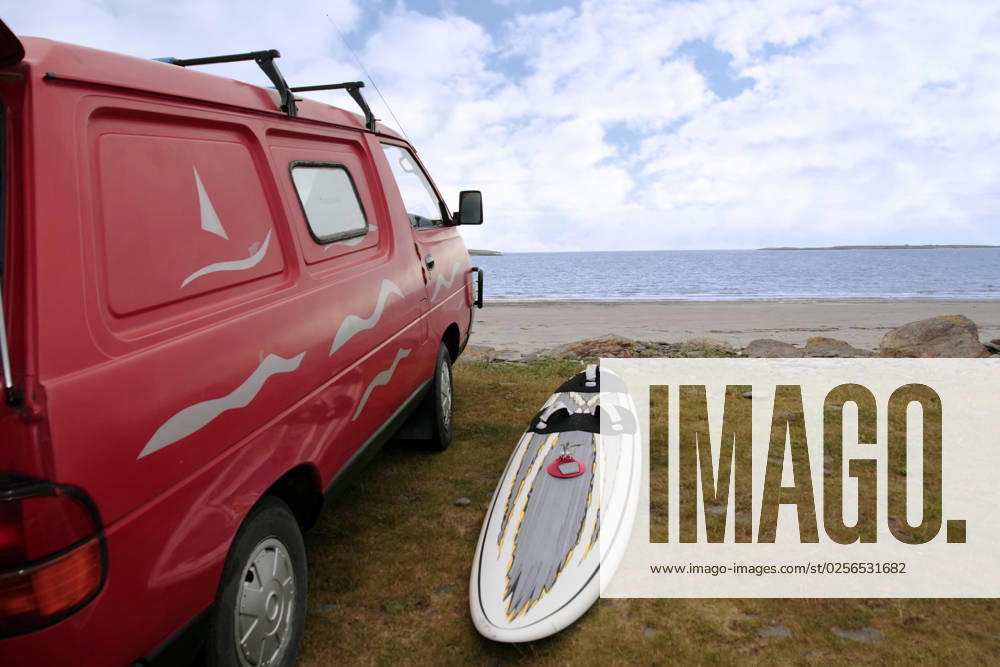 A van and windsurf equipment on the beach in the maharees county kerry ireland