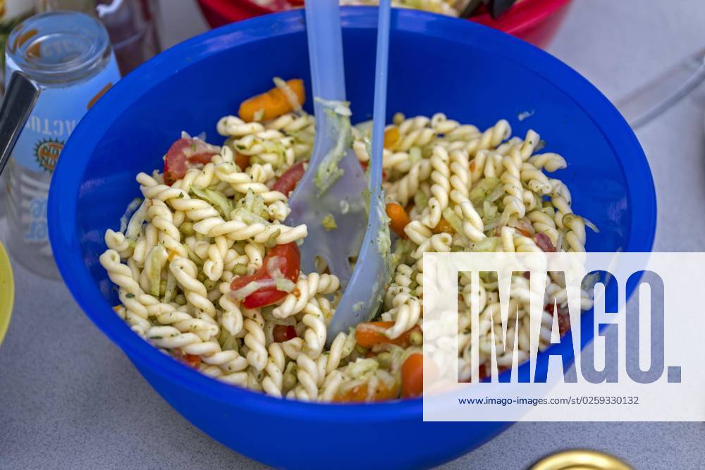 barbecue on the balcony, the barbecue sauces, salads and cutlery are ready at the table Here the pasta salad 08 06 2023, barbecue 08 06 2023, barbecue