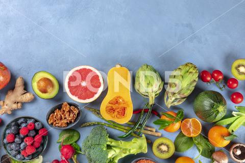 Vegan food. Healthy diet concept. Fruits, vegetables, nuts, mushrooms, shot from the top. A flat lay composition with a place for text vegan, vegetarian, food, healthy, diet, background, fruit, vegetable, above, view, top, shot, flat, lay, flat lay, flatlay, nuts, table, cooking, kitchen, fresh, nutrition, veg, produce, supermarket, organic, vitamin, carbohydrate, fiber, wholesome, superfood, grapefruit, artichoke, broccoli, various, variety, assortment, many, different, copy, space, copyspace, copy space, place, text, overhead, avocado, ginger, farmers, market