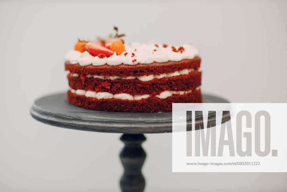 Pastry chef makes delicious red velvet cake. Cooking and decorating dessert Pastry chef makes delicious red velvet cake. Cooking and decorating dessert.