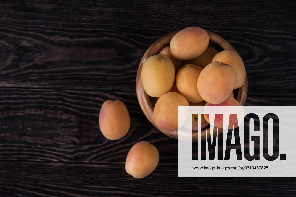 Orange fresh apricots on a wooden background, model released, , 22499644.jpg, healthy, fresh, fruit, orange, ripe, vegetarian, apricot, closeup, natural, food, summer, yellow, sweet, organic, dessert, leaf, plant, juicy, background, white, color, season, nature, macro, wood, wooden, garden, diet, tasty, bio, design, group, art, green, bright, spring, space, object, outdoor, one, outside, flower, dark, red, vibrant, table, copy, seed, agriculture, RECORD DATE NOT STATED
