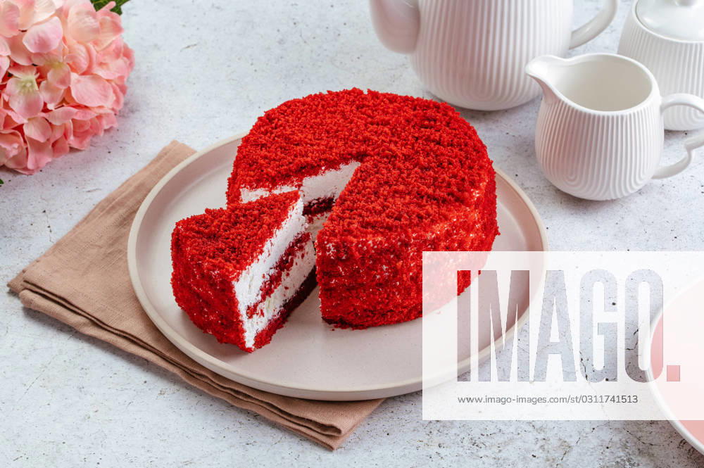 Red velvet cake with buttercream on a plate. Paris, Île-de-France, France R_KUAL231030-1276300-01