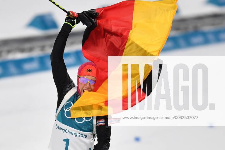 Laura DAHLMEIER GER 1 square gold medallist gold gold medal Olympic champion at the finish finish with the German flag flag Jubilee joy cheers emotion enthusiasm cheer cheers action cross country skiing 10 km pursuit biathlon Womens s 10 km pursuit of women on 12 02 2018 Winter Olympics 2018 from 09 02 25 02 2018 in PyeongChang of South Korea